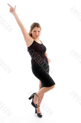 beautiful young woman pointing upwards