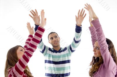 portrait of friends with raised arms