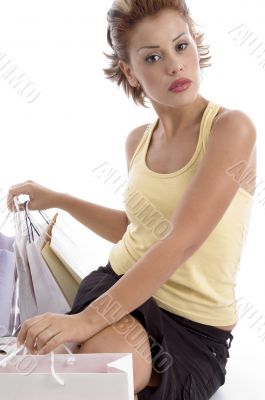 sitting sexy woman with shopping bag