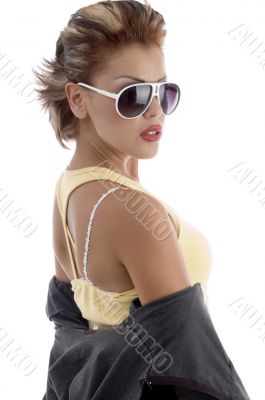 side view of young female posing with eyeglasses