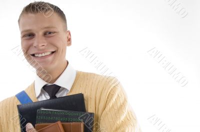 casual teenager preparing to school and smiling