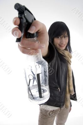 female with spray bottle