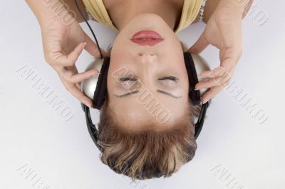 laying woman with headphone