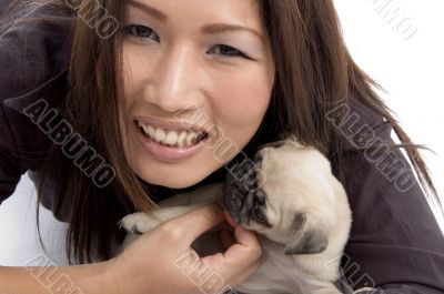 portrait of female with little puppy