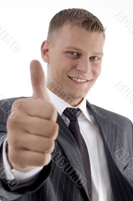 smiling handsome young manager showing thumb up