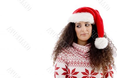young female with christmas hat looking upward