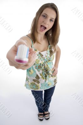 young woman showing her toothbrush