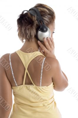 back pose of female with headphone