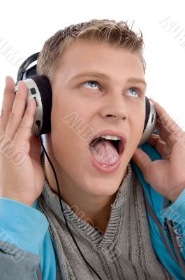 man listening through headphone