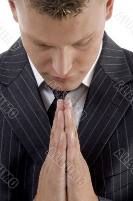 praying young businessman
