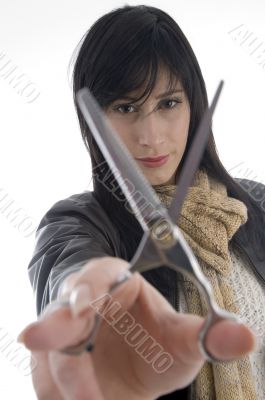 female barber holding scissors