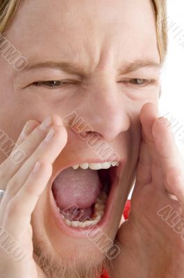 face of male shouting loudly