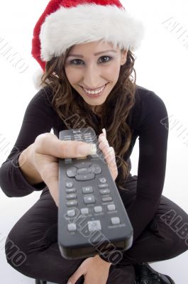 smiling woman with remote control