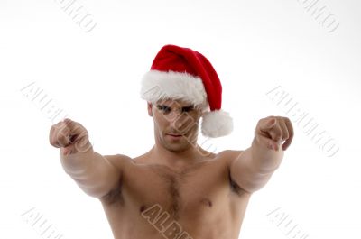 cool muscular man wearing christmas hat
