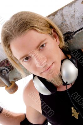 close up view of handsome guy with skateboard