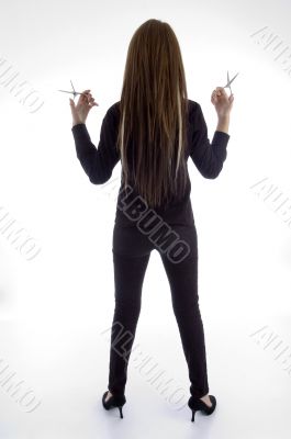 young female barber posing from back
