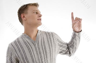 young man looking at his finger