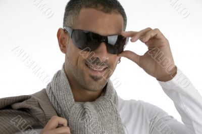 handsome male holding eyewear