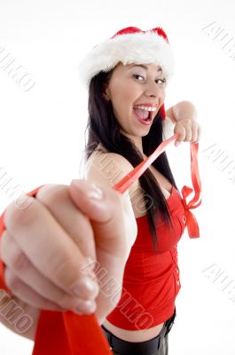 pretty young female in christmas hat smiling