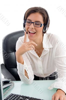 smiling female looking into laptop