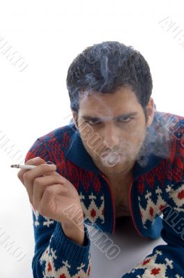 laying male holding cigarette