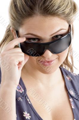 pretty model holding sunglasses
