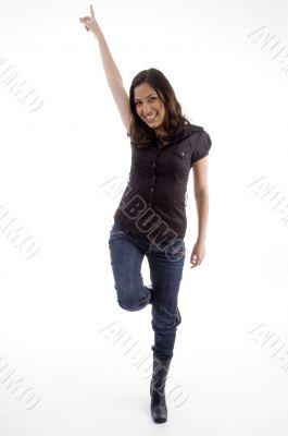 standing happy young woman pointing up
