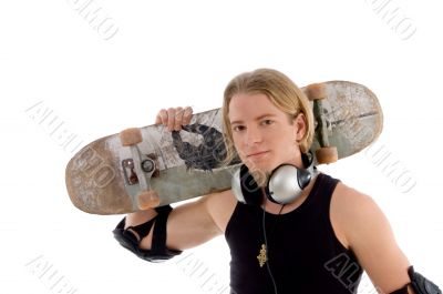 handsome man holding skateboard