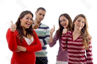 a group of smiling people with thumbs up