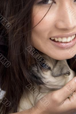 pretty woman holding puppy
