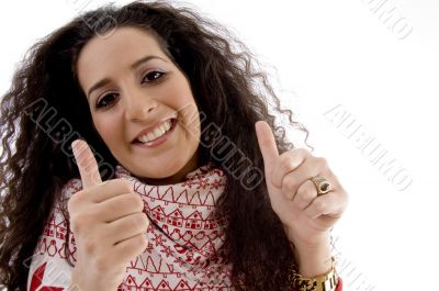 young woman showing thumb up with both hands