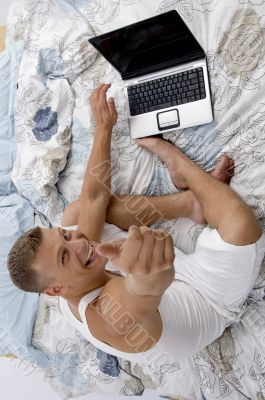 man with laptop and thumbs up