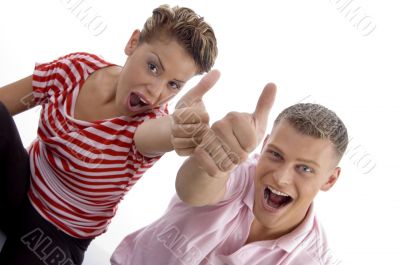 corner view of couple with thumbs up