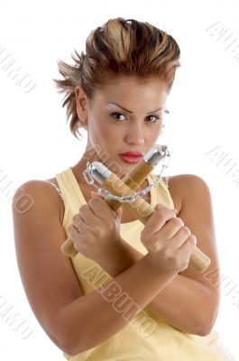 young female with nunchaku