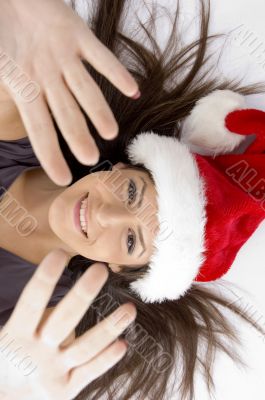attractive woman lying on floor and showing palms