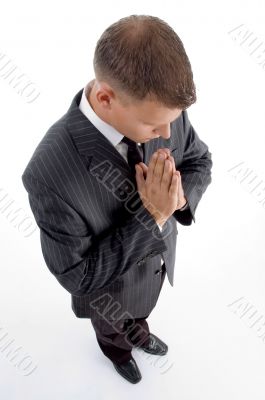 high angle view of praying businessman