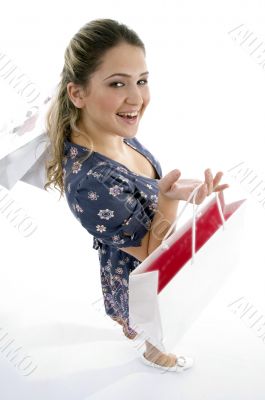smiling woman holding shopping bags