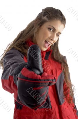 caucasian woman with winked eye showing thumbs up