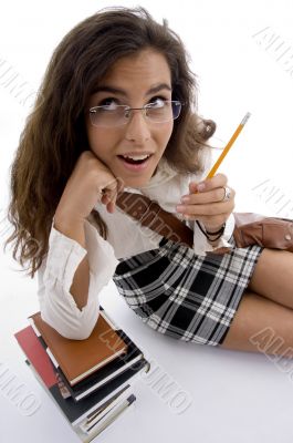 young student with books and pencil