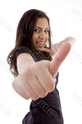 smiling young woman showing thumb up