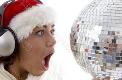 surprised woman looking to disco ball