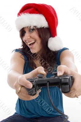 brunette female with christmas hat and remote