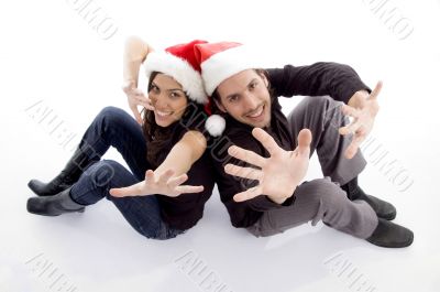 young couple wearing christmas hat