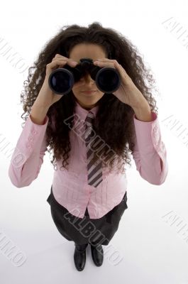 young businesswoman using a pair of binoculars