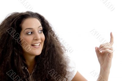 close up view of beautiful woman pointing upwards