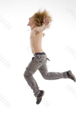 side pose of male jumping in air