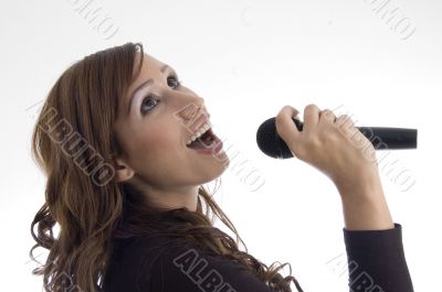 woman singing in microphone