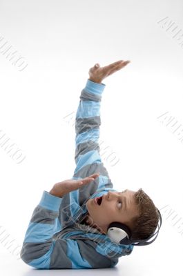 laying young man with headphone looking upside