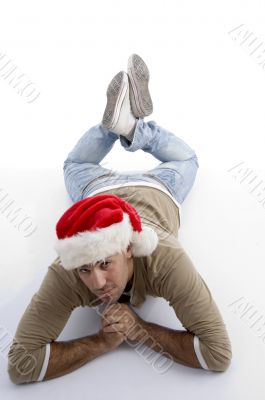 man lying and wearing christmas hat