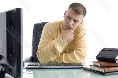 thinking man while looking on screen